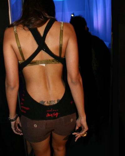 She is all game to flaunt her tattoo inscribed at her back, over the butt!